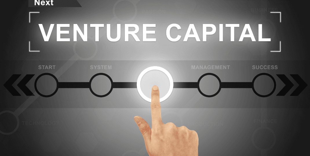 finger pressing on Venture Capital lettering