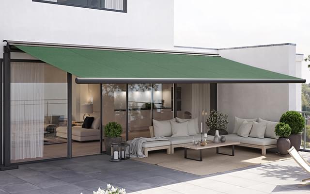 Markilux syncra uno with one sided cassette awning markilux 1600 with green fabric cover on a roof terrace