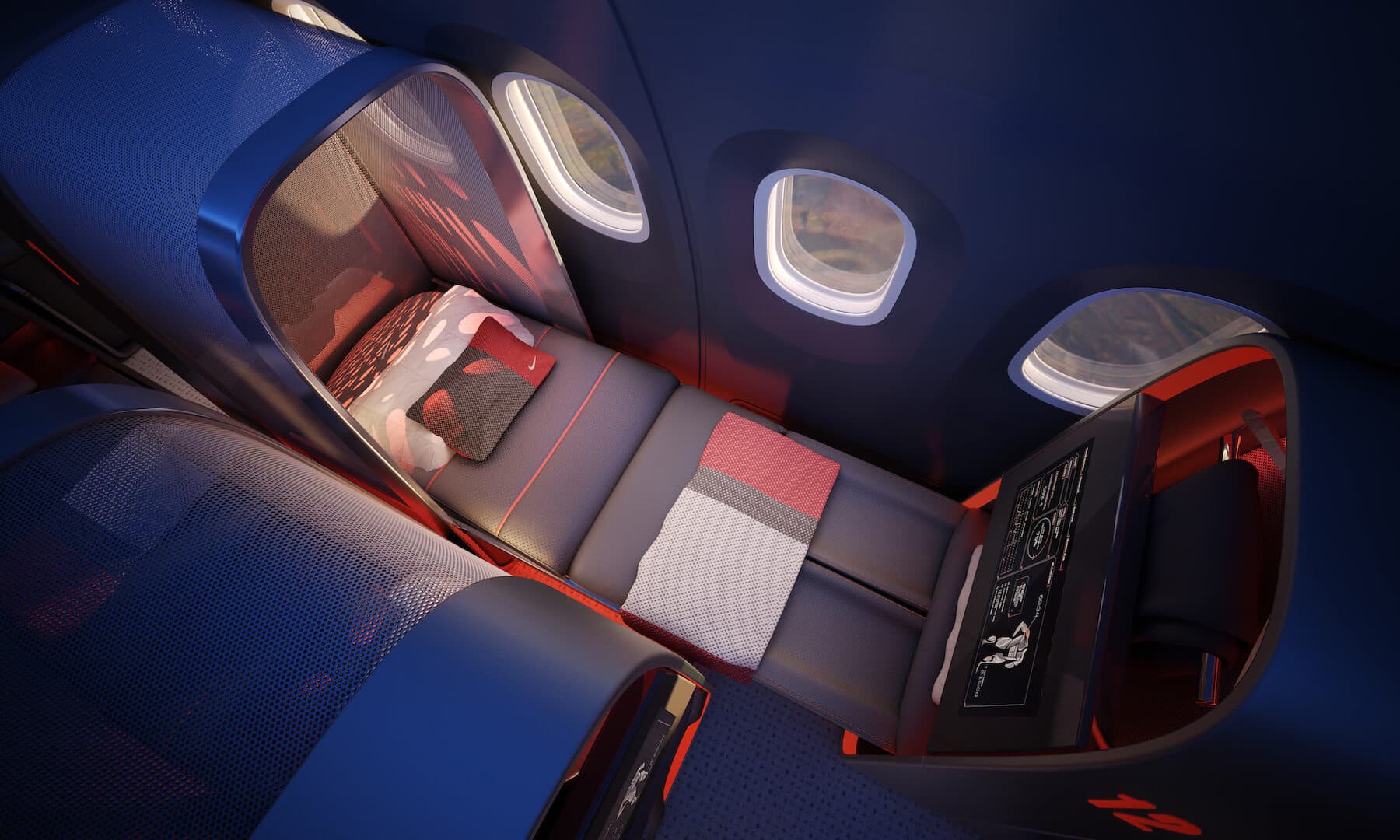 Top view of lay flat seat in airplane with red and white blanket and blue dynamic lighting