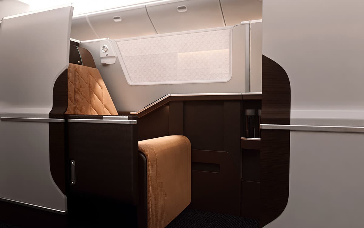 Oman Air Business Class suite in shades of brown and white with door open