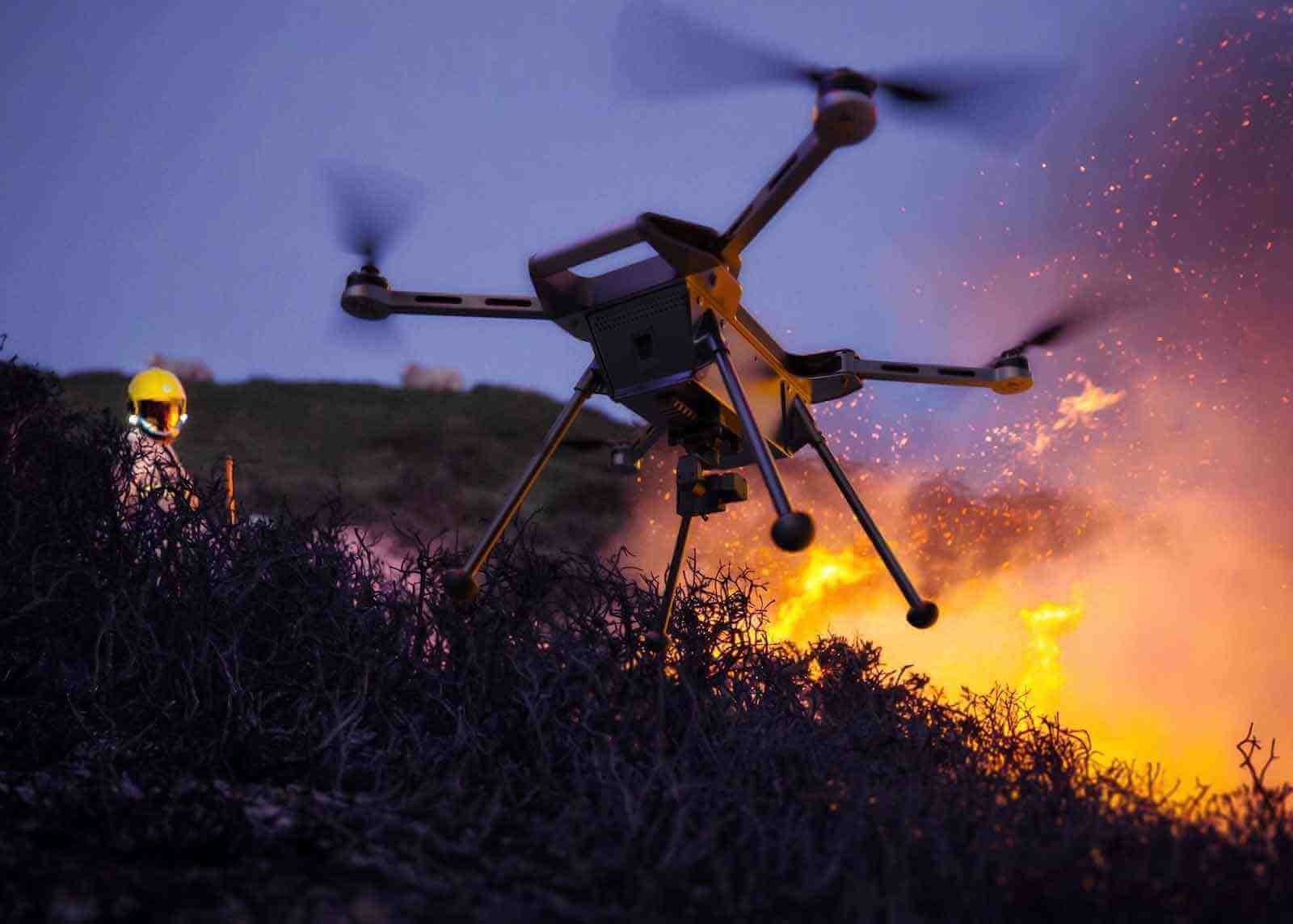 Industrial drone helping fire fighters contain fast moving fire