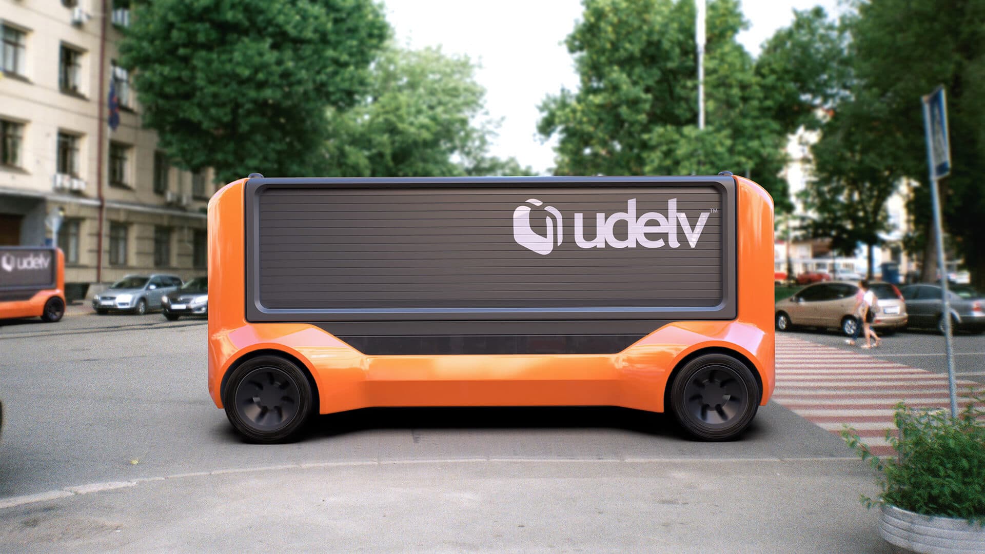 Udelv autonomous Transporter vehicle on city street