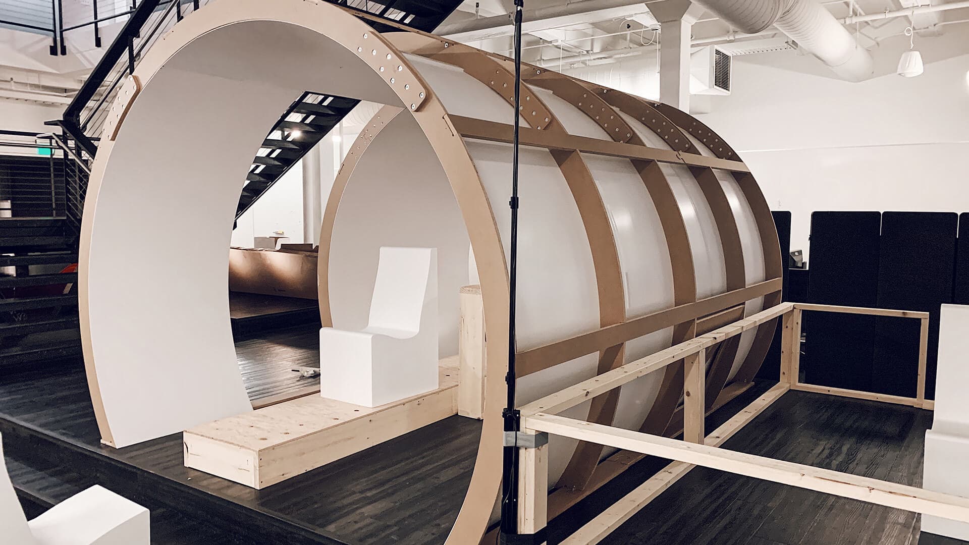Virgin Hyperloop passenger pod mock up sitting in modern office