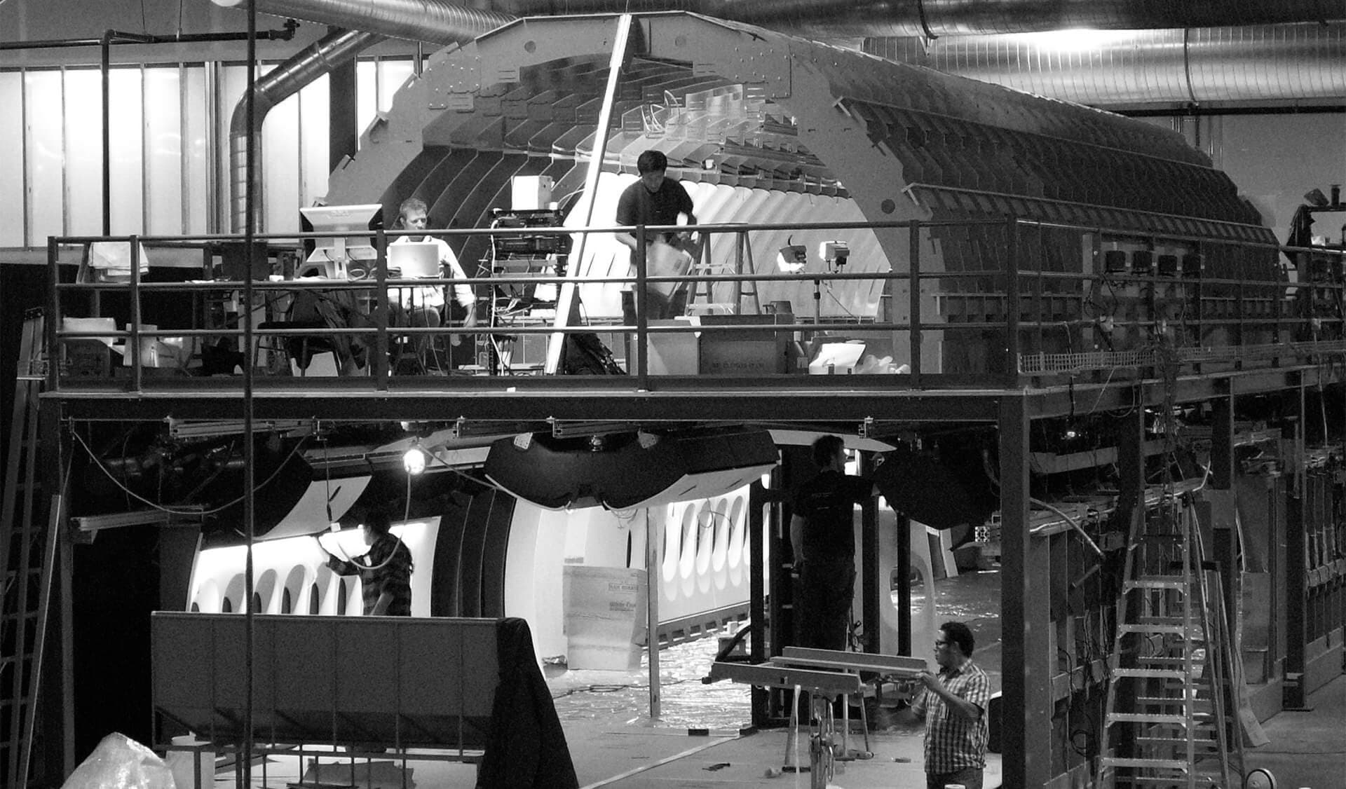Four men working in large scale 747 mockup