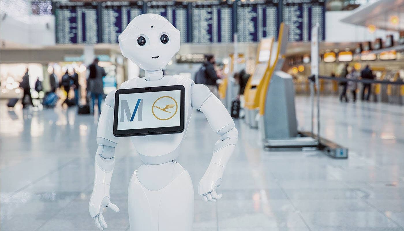 Robot welcoming travelers in airport