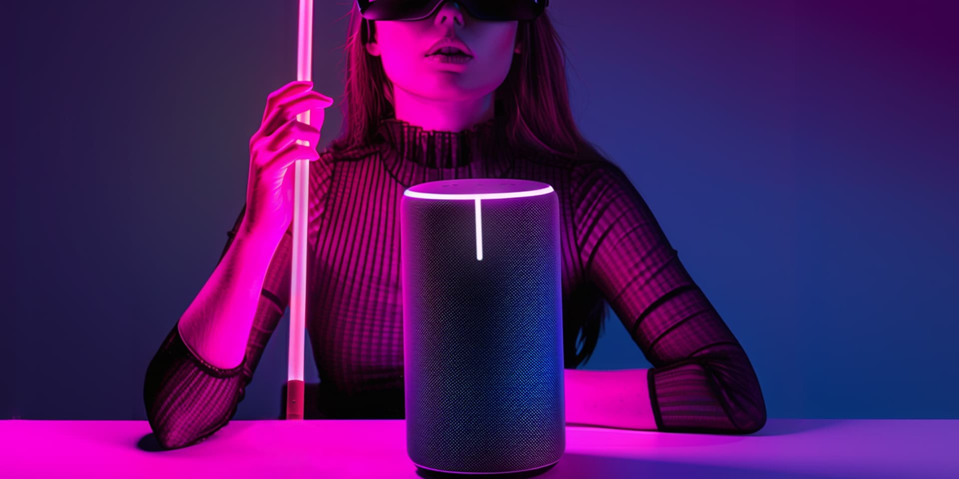 Woman sitting in low lit room with dark glasses and a white and red cane sitting in front of a smart speaker