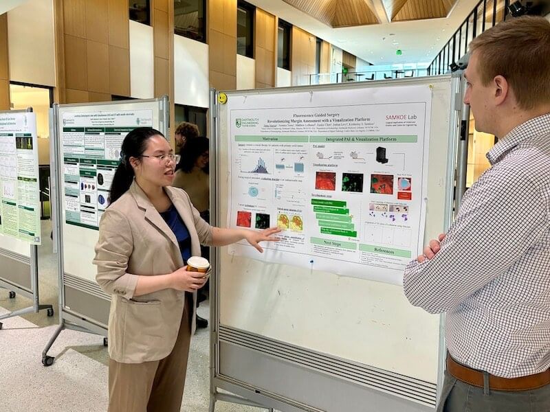 A BME student presents her poster at the "Research-in-Progress" symposium.