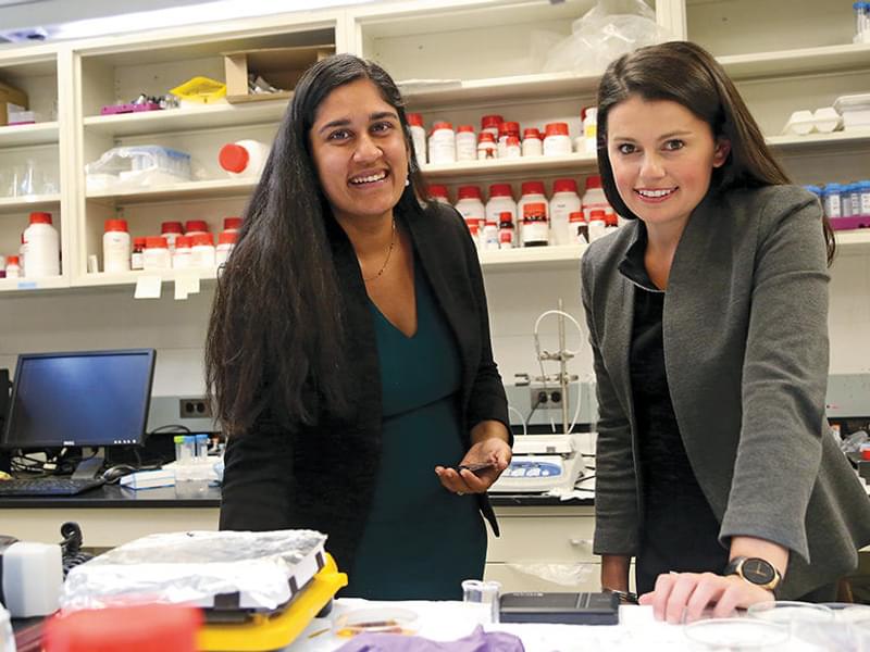 Two female I-Corps Grant awardees work on a research project together in a lab.