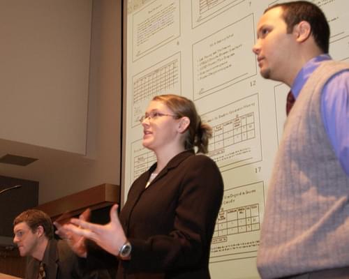MEM students presenting data and solutions they found during an internship project.