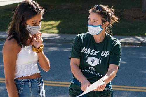 Assistant Dean Holly Wilkinson welcomes students to campus with masks on Assistant Dean Holly Wilkinson welcomes students to campus with masks on