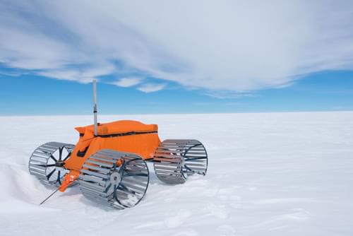 Mechanical frostyboy travels over a vast plain of snow.