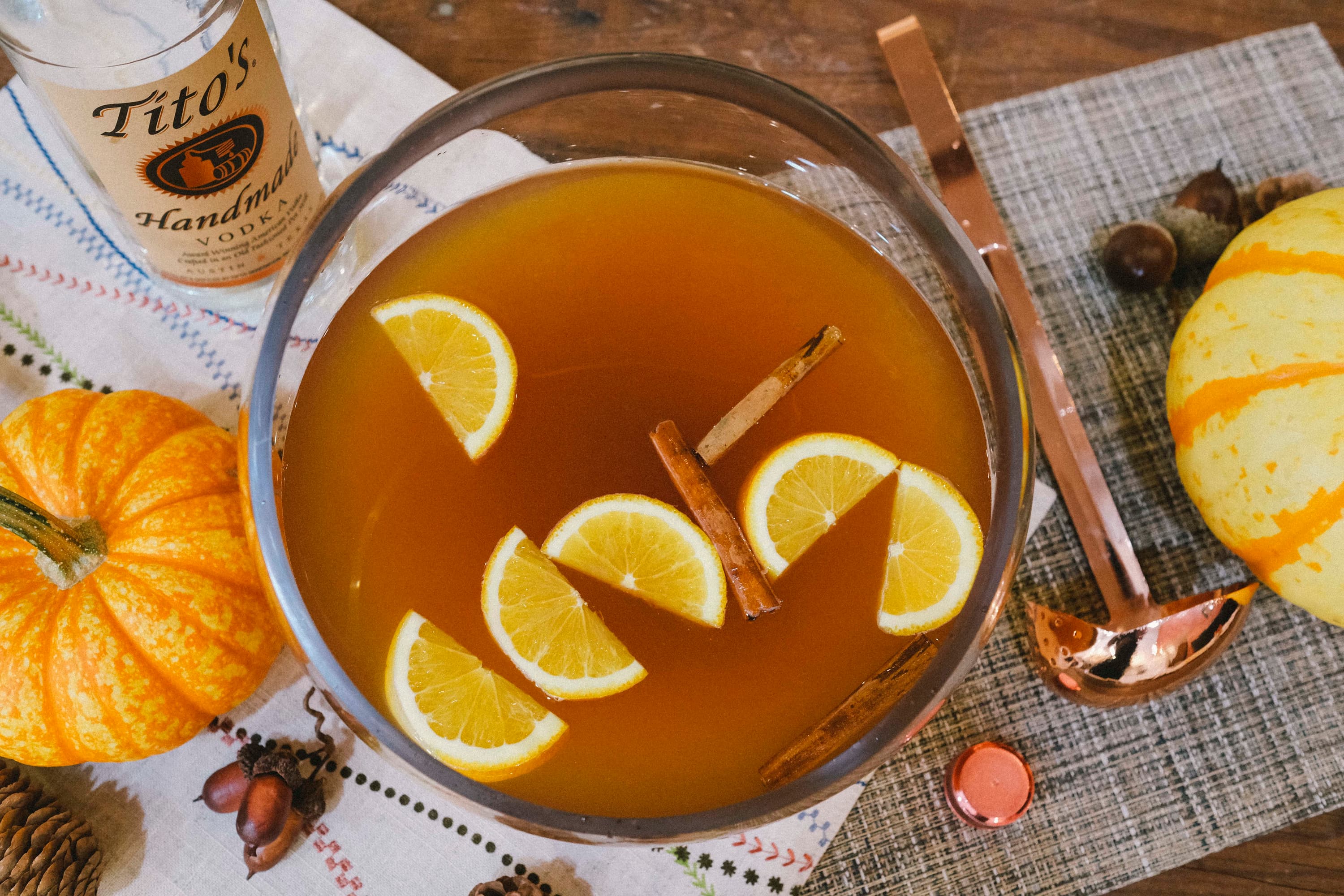 Tito's Vodka Harvest Punch cocktail with oranges and cinnamon