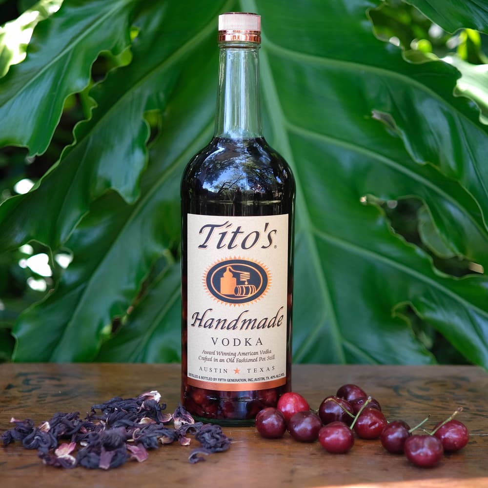 Hibiscus & Dried Cherry Infusion in a Tito's Vodka bottle