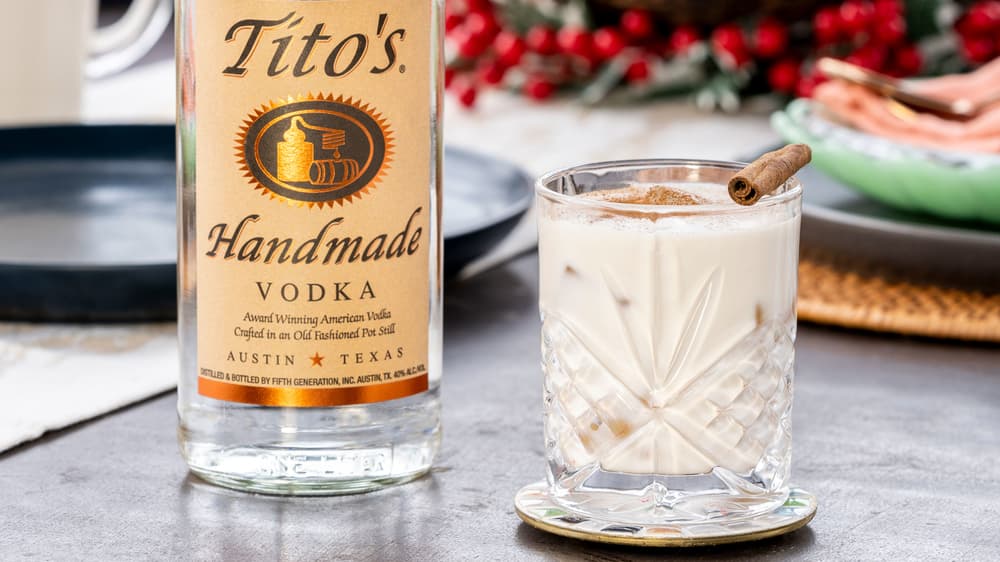 Tito's Coquito garnished with a cinnamon stick