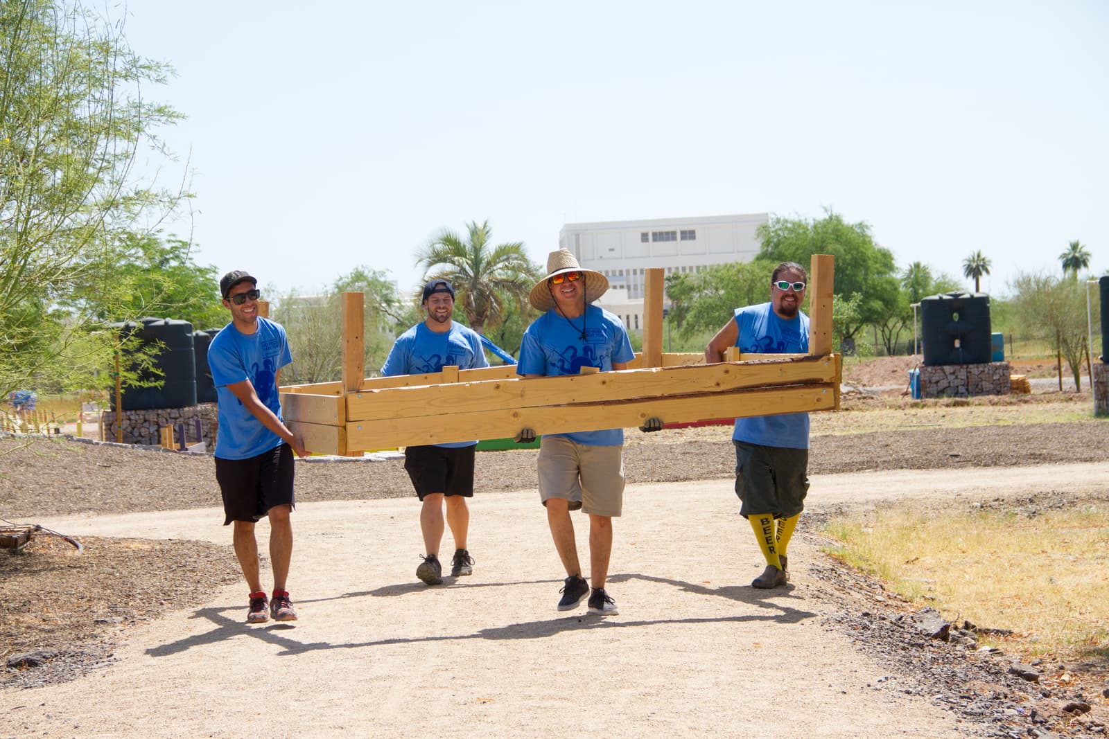 Keep Phoenix Beautiful Volunteers Carry Wood
