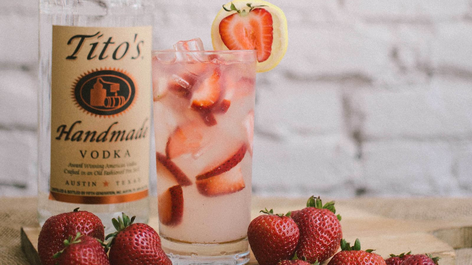 Tito's Strawberry Lemonade garnished with a lemon slice and strawberry slice