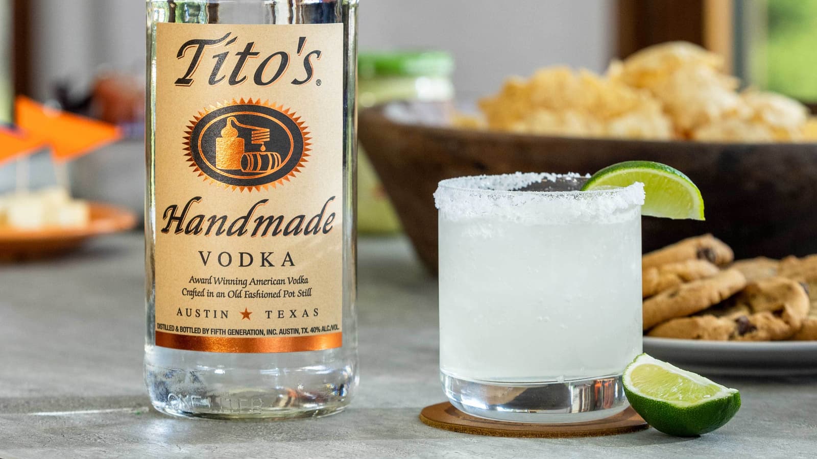 Titorita Touchdown in a rocks glass next to a Tito's Handmade Vodka bottle