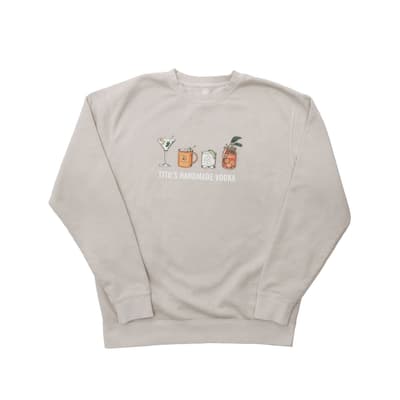 Tito's natural-colored crewneck sweatshirt with illustrations of a martini, mule, Tito's soda lime, Bloody Mary and Tito's Handmade Vodka text