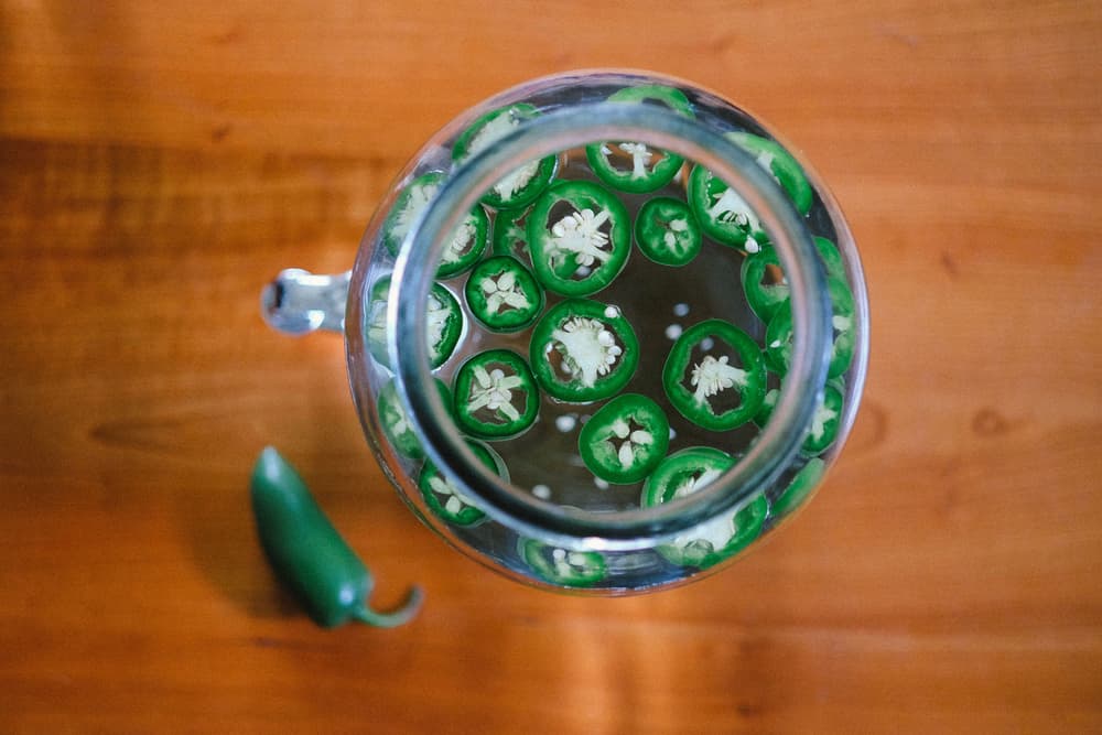 Mason Jar full of Tito's and jalapenos
