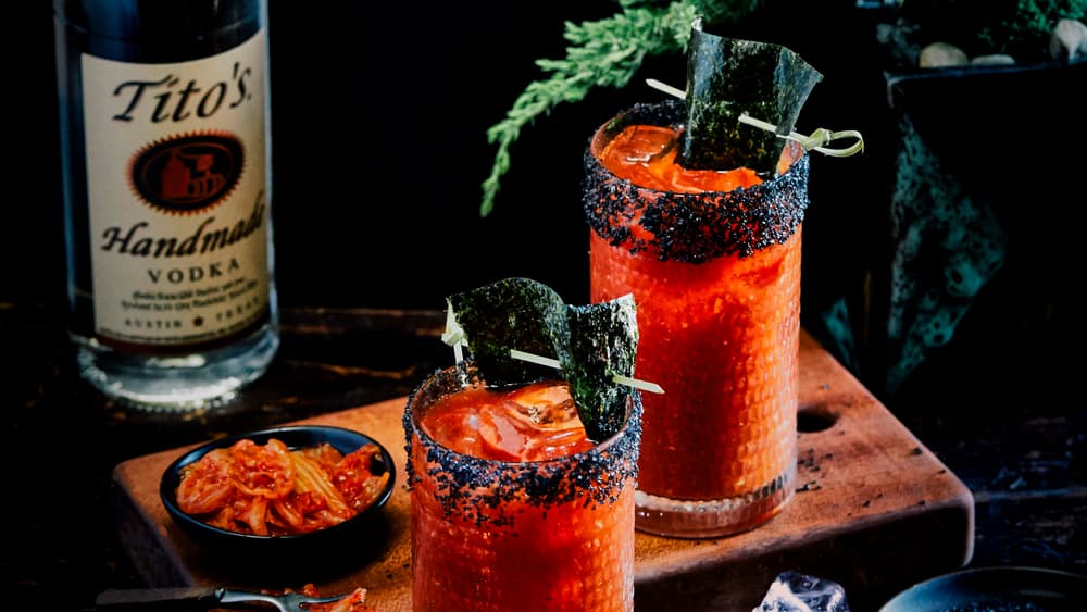 Two Tito's Kimchi Bloody Marys garnished with nori strips