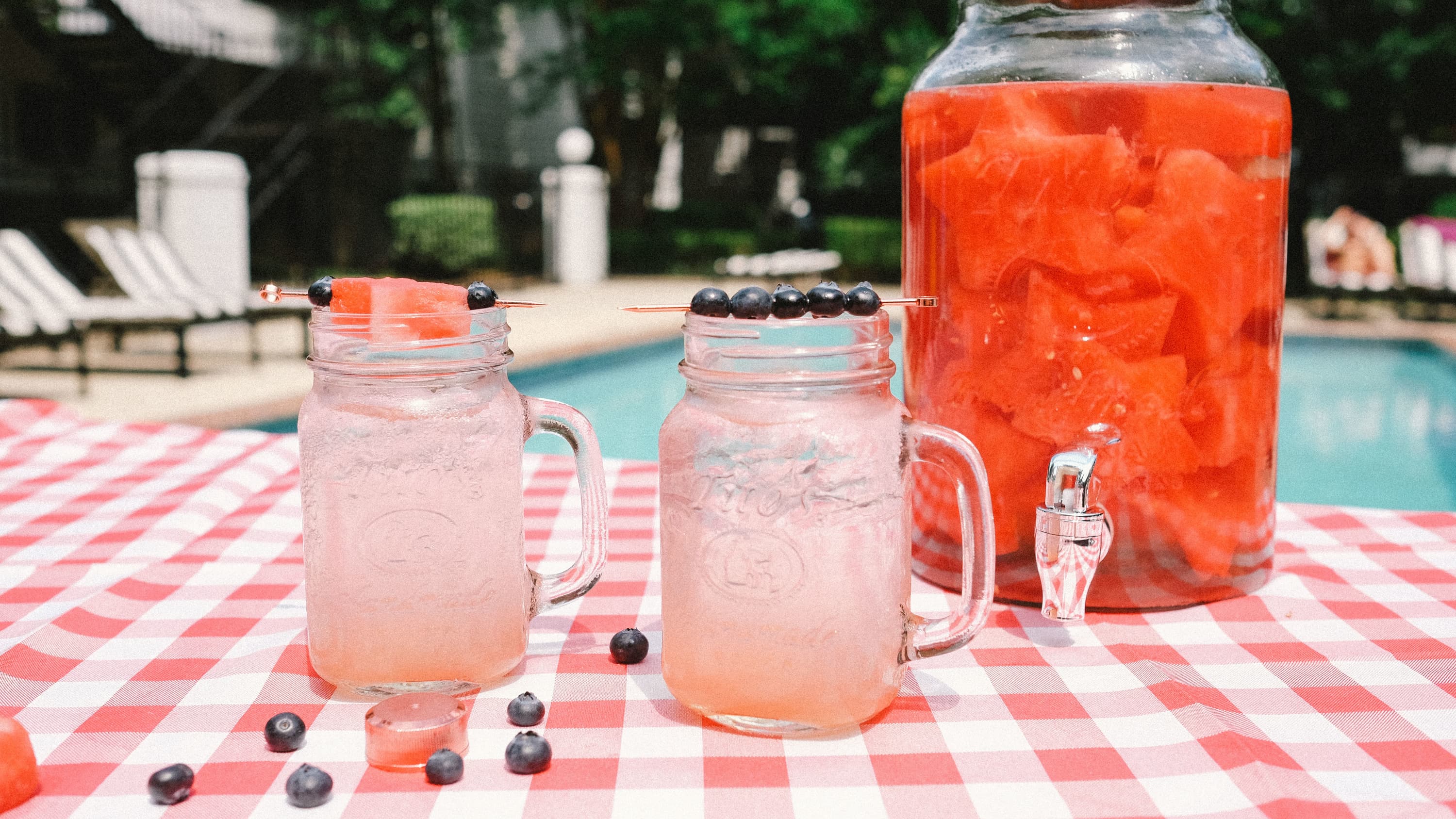 Titos Summertime Sparkler in mason jars garnished with watermelon and blueberries