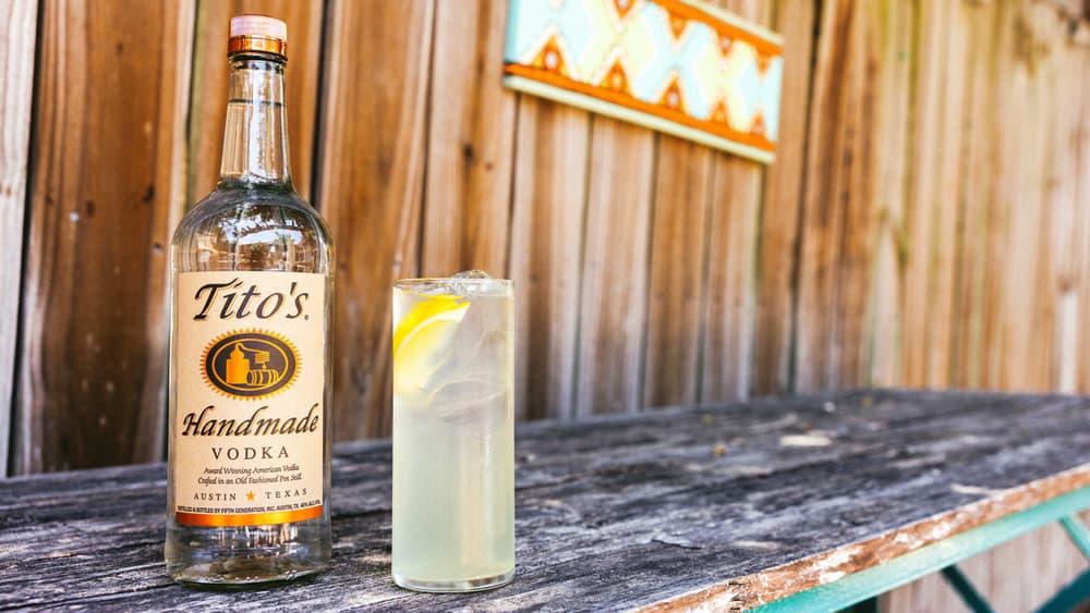 Tito's Sunny Dog Day cocktail and a Tito's Handmade Vodka bottle