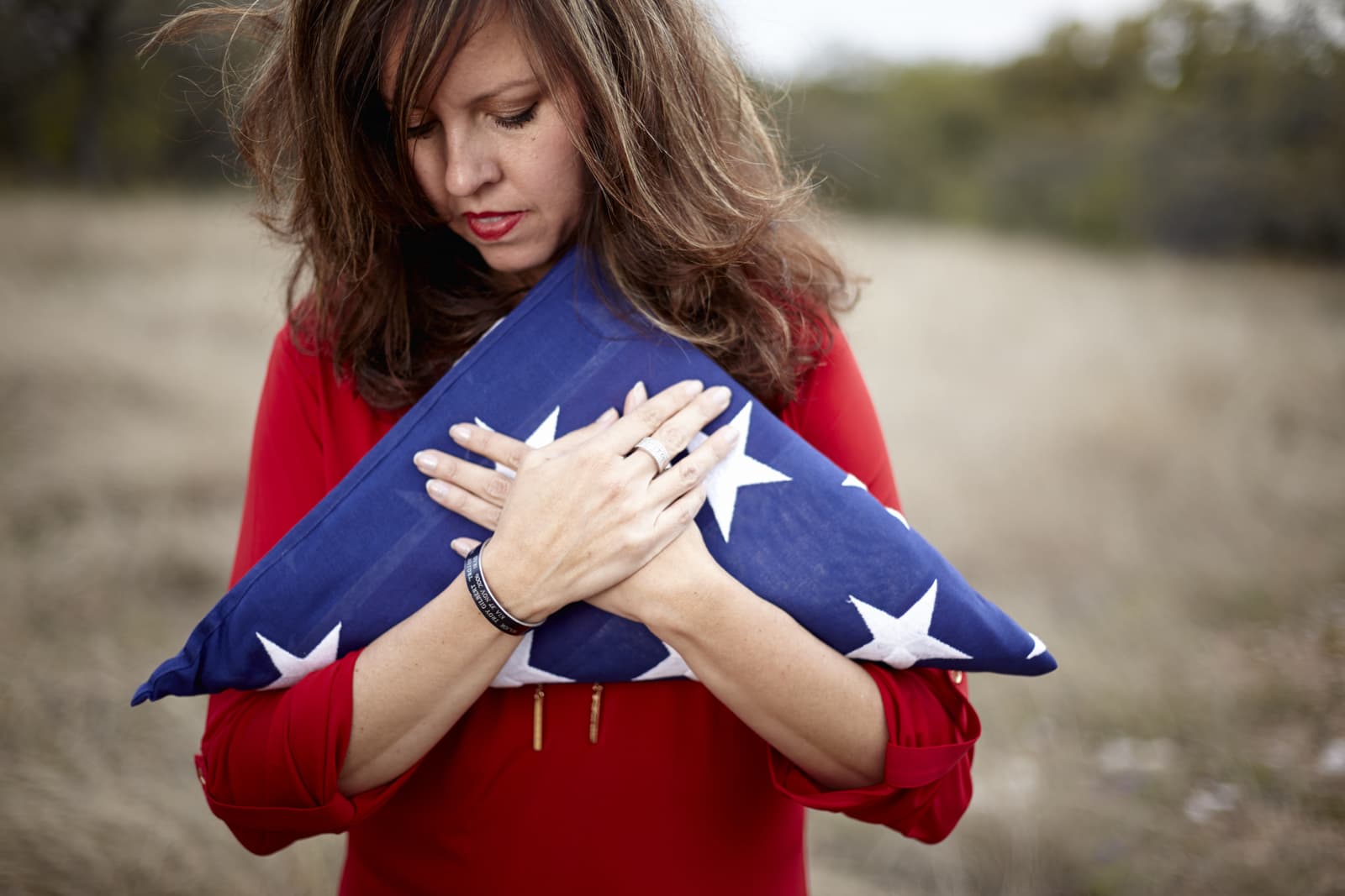 Folds of Honor Woman Holding American Flag