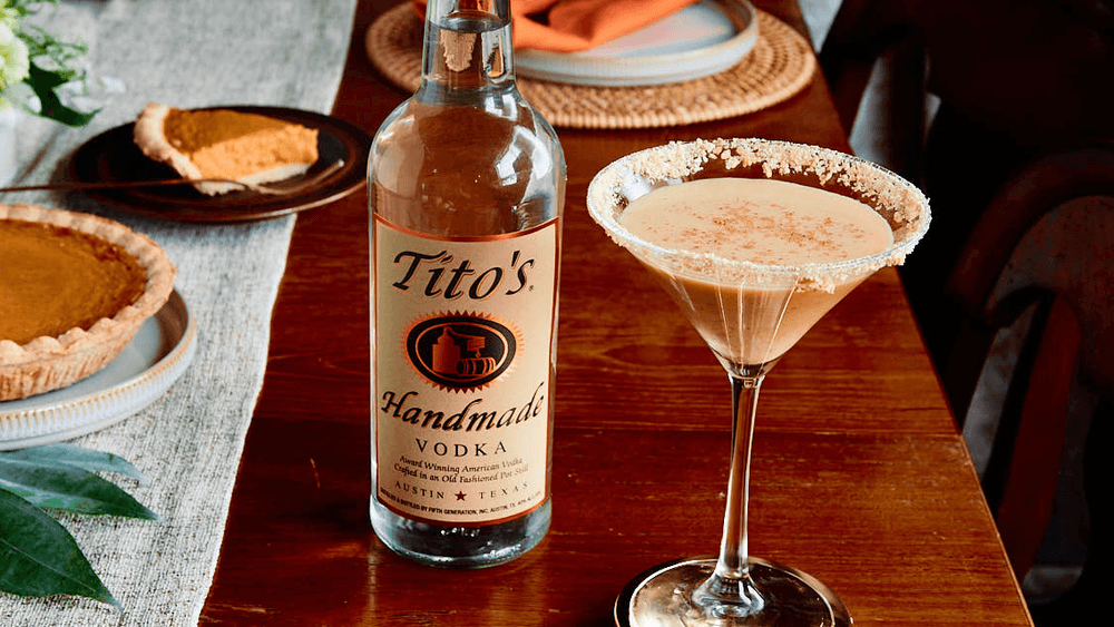 Tito's Handmade Vodka bottle and Tito's Pumpkin Pie martini on Thanksgiving table