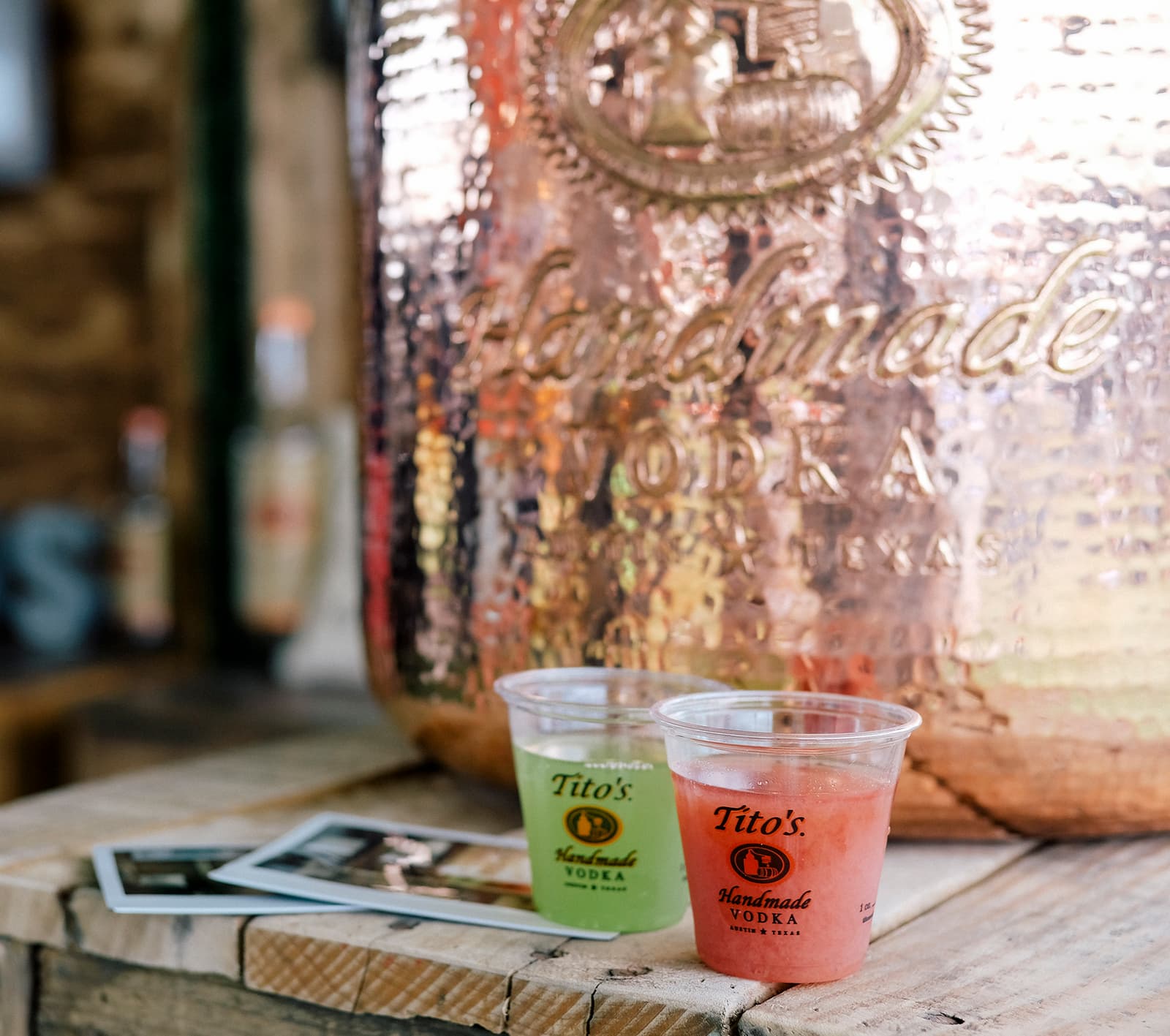 tito's vodka cocktails in front of copper pot still