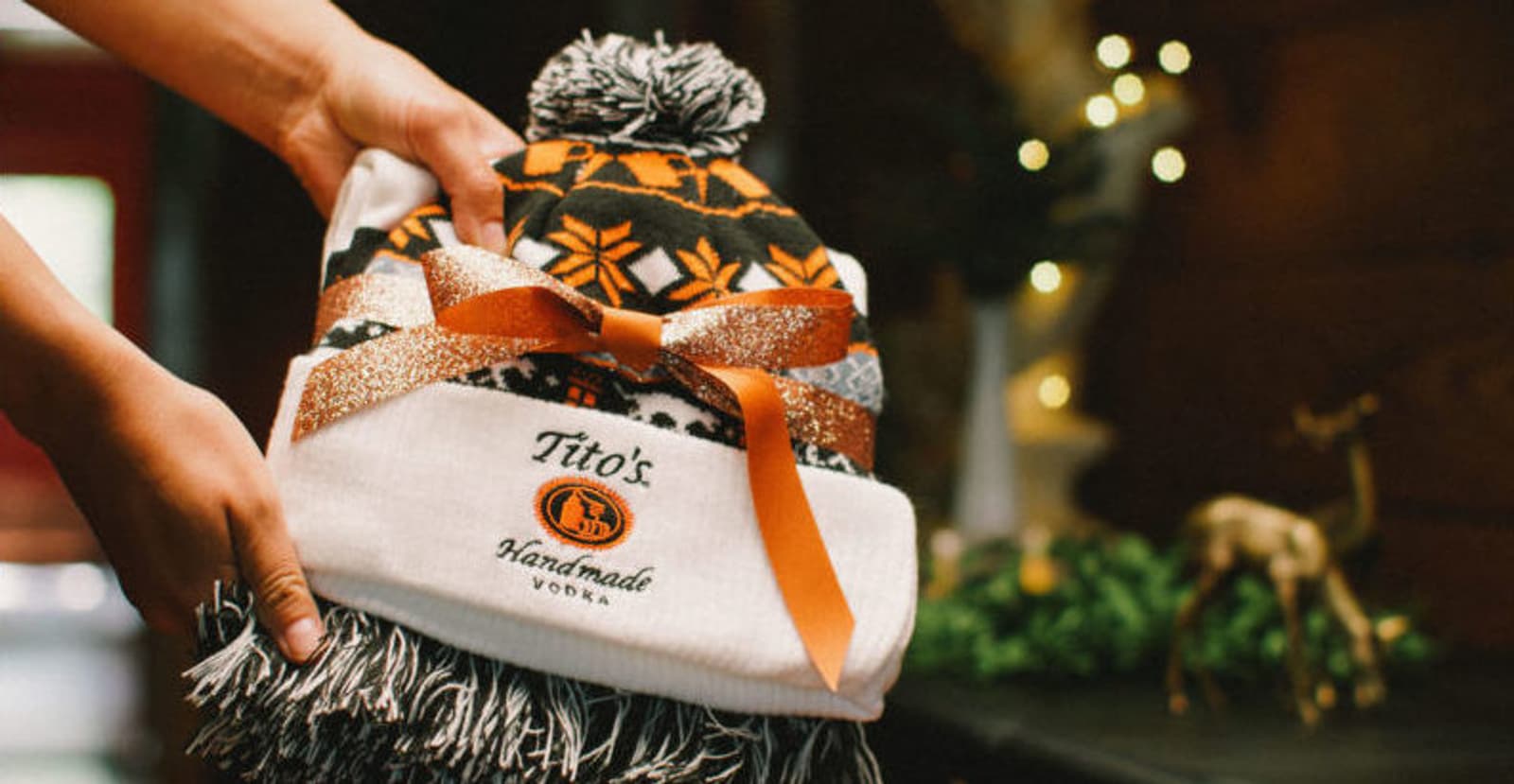 Tito's Ugly Scarf and Beanie wrapped in an orange bow