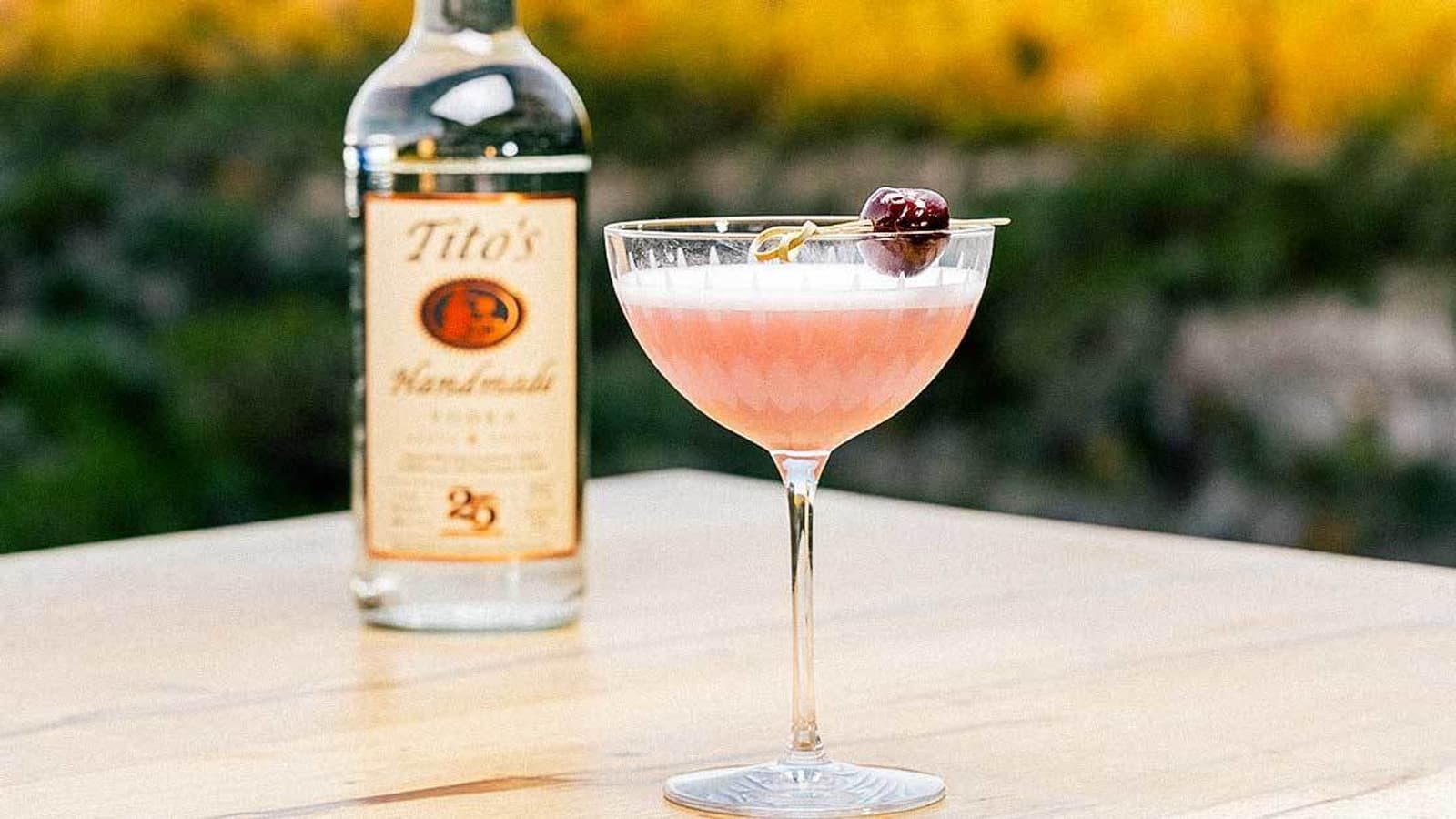 Tito's Shack Cherry Sour with Tito's 25th Anniversary Bottle
