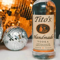 Tito's Vodka bottles surrounded by disco balls