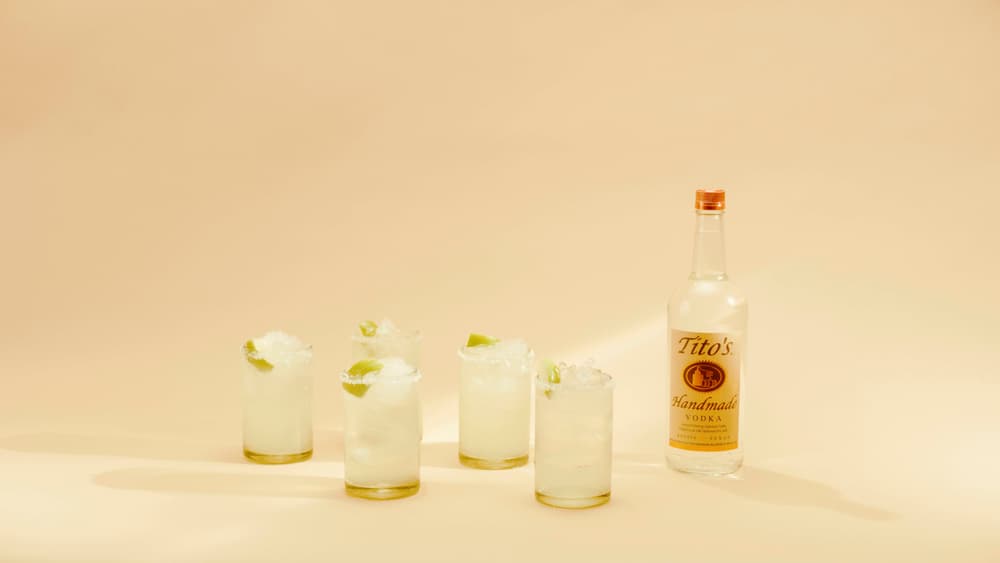 Four TitoRita's next to a Tito's Vodka Bottle