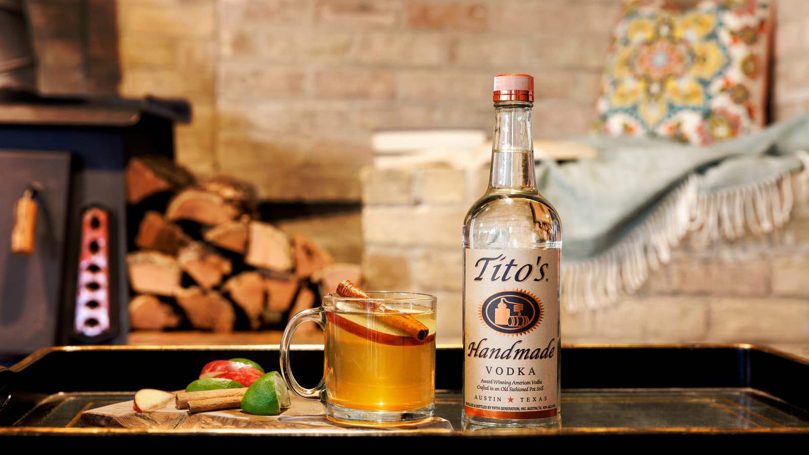 Titos spiced Cider Mule garnished with apple and cinnamon sticks