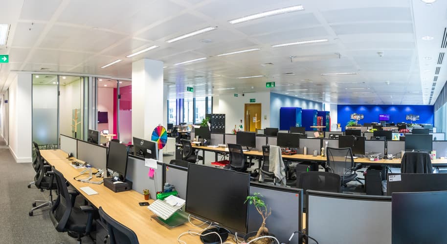 banks of empty desk in modern office