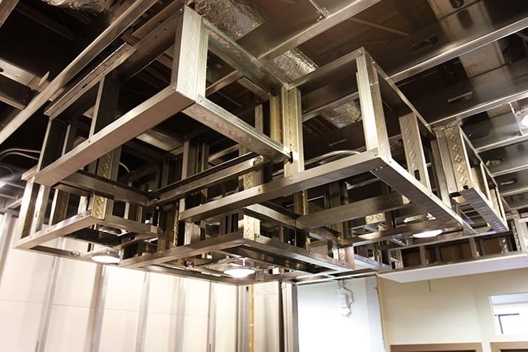 Using framing with steel studs to create framing for unique ceiling details in commercial application.