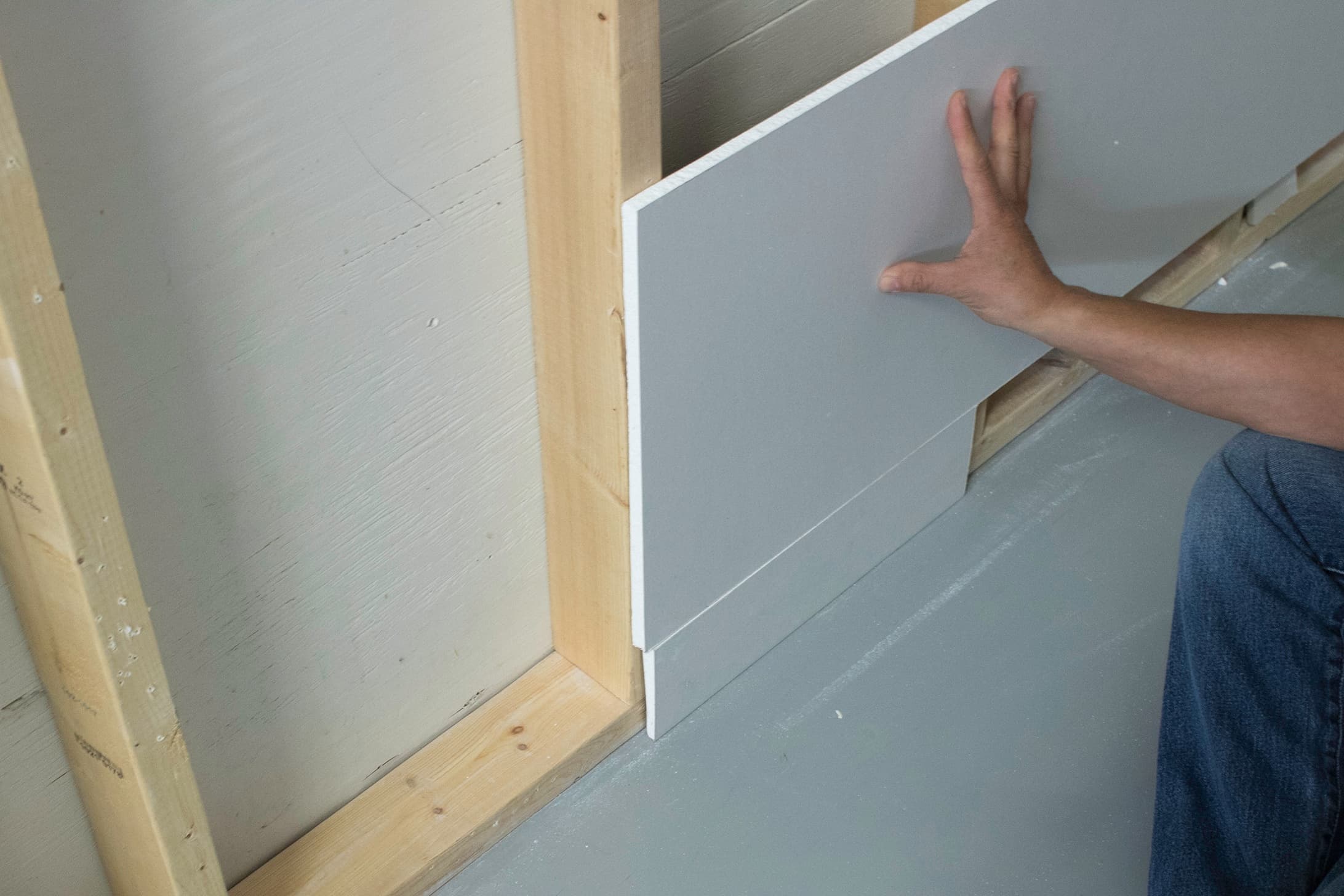 Once baseboard height is determine, take a scrap piece of drywall to act as a guide when installing the drywall to ensure adequate room for baseboard.