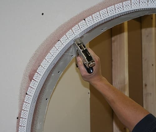 Vinyl archway corner bead is pre-notched to make easy work of finishing arches and curves. Vinyl archway corner bead is pre-notched to make easy work of finishing arches and curves.