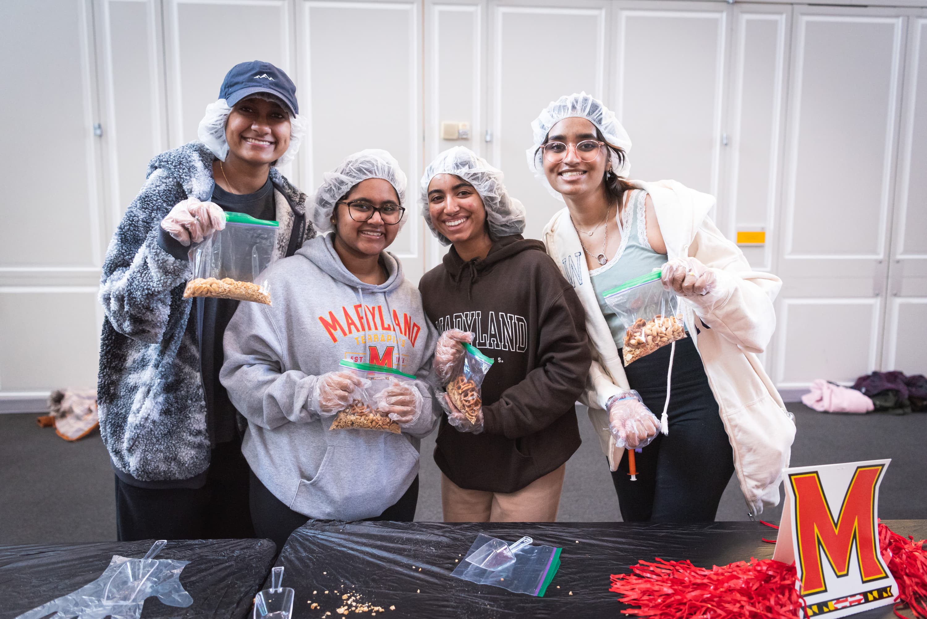 A group of volunteers poses for a picture at the Martha's Table volunteer event at the Riggs Alumni Center