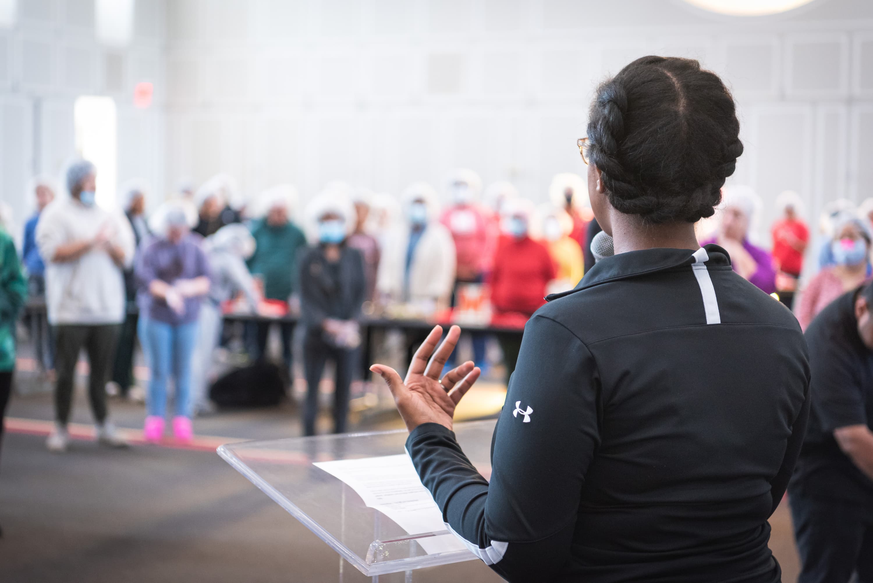 Erica Lane, Manager of Volunteer Programs, provides instructions to volunteers