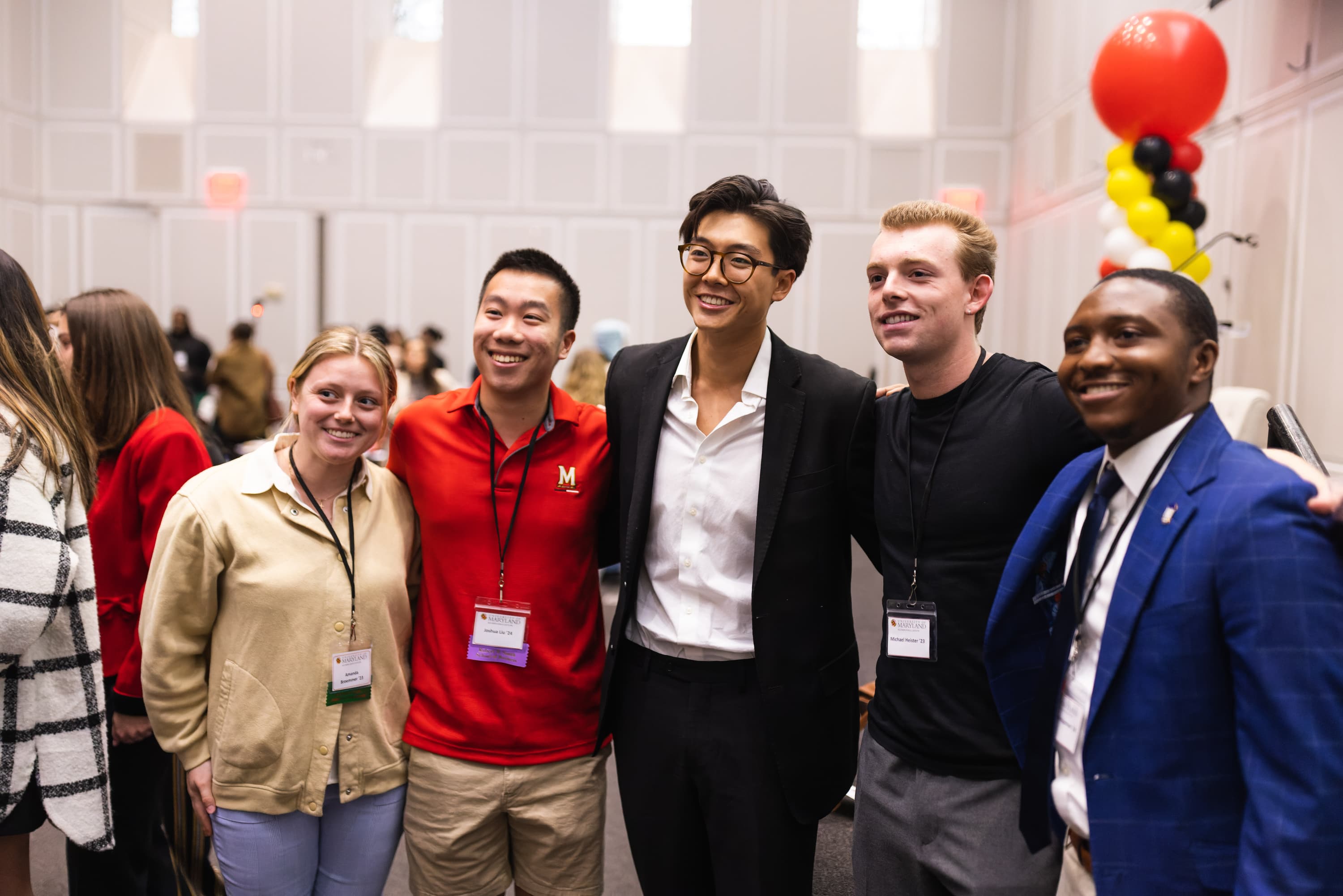 Derek Xiao '19 poses with a group of Terps Under 30 participants for a group photo