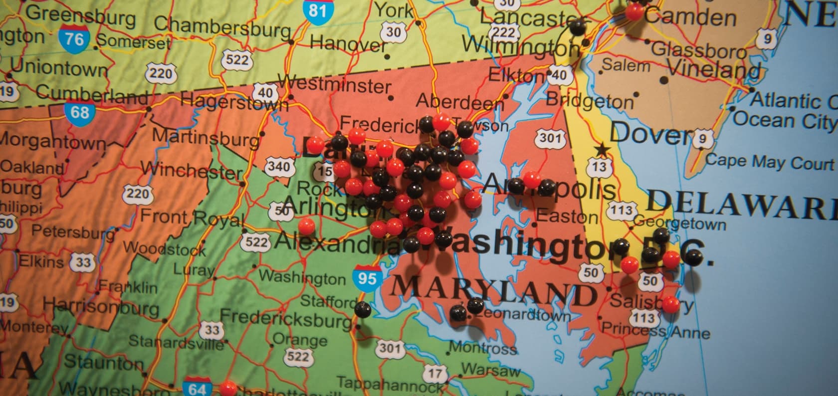 Colorful map focused on the state of Maryland with a number black and Maryland push pins marking locations in the Delaware-Maryland-Virginia region