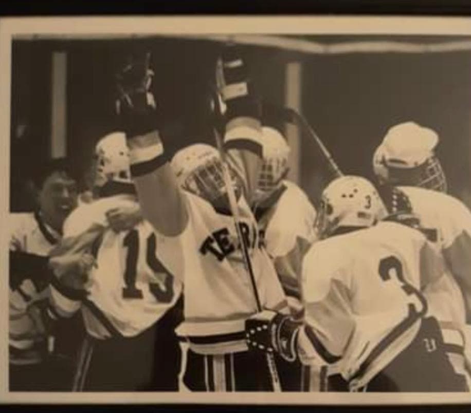 The 1991-92 UMD Club Hockey Team celebrating their win at the Crab Pot Tournament.