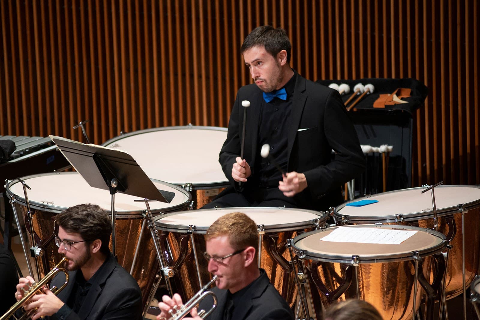 A man plays the drums.