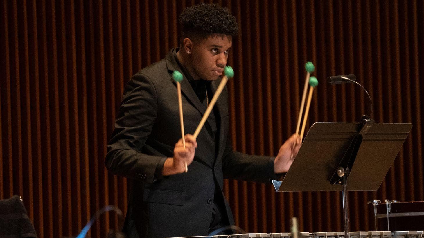 Student playing xylophone.