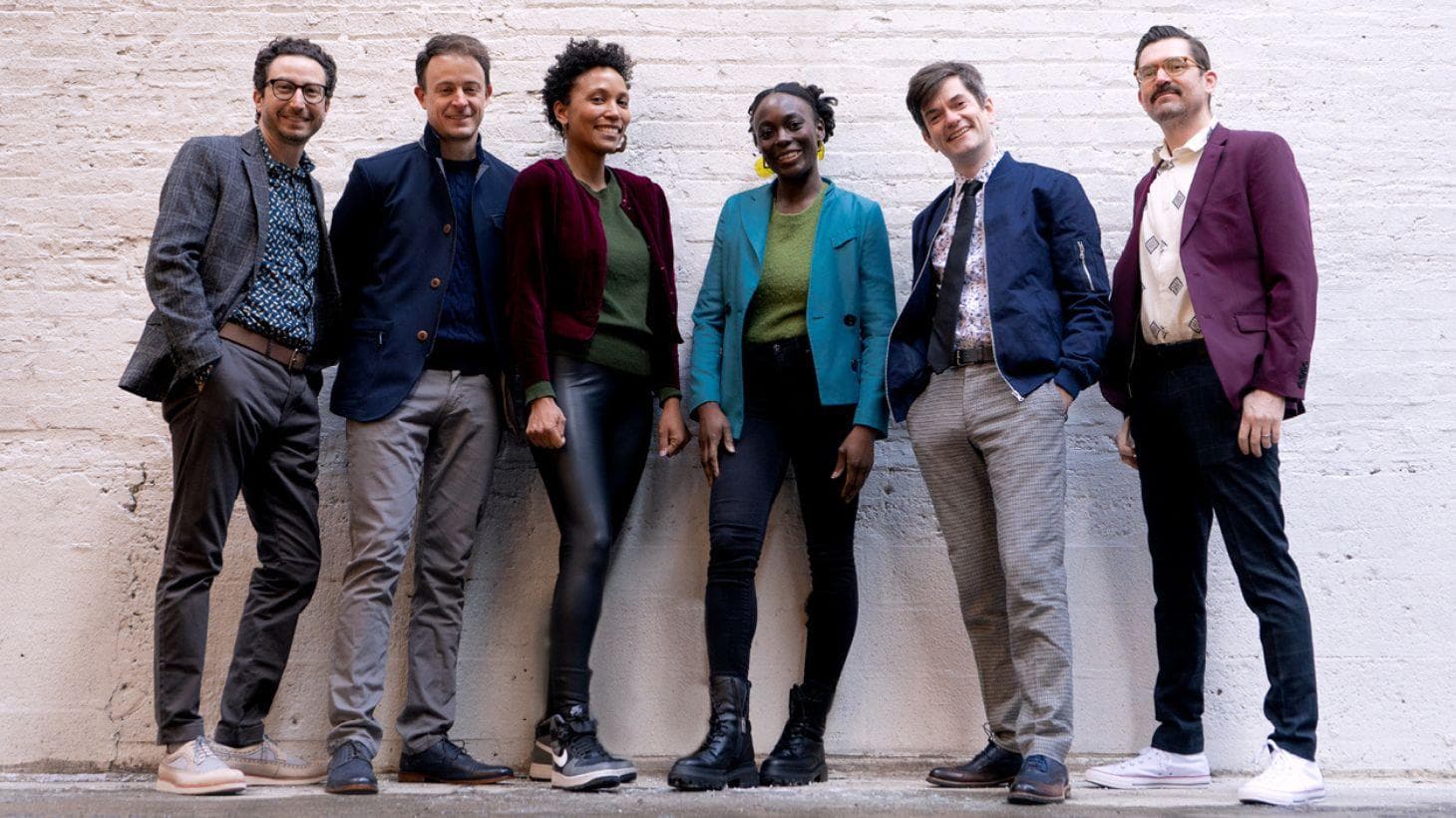 Six ensemble members pose for a picture.