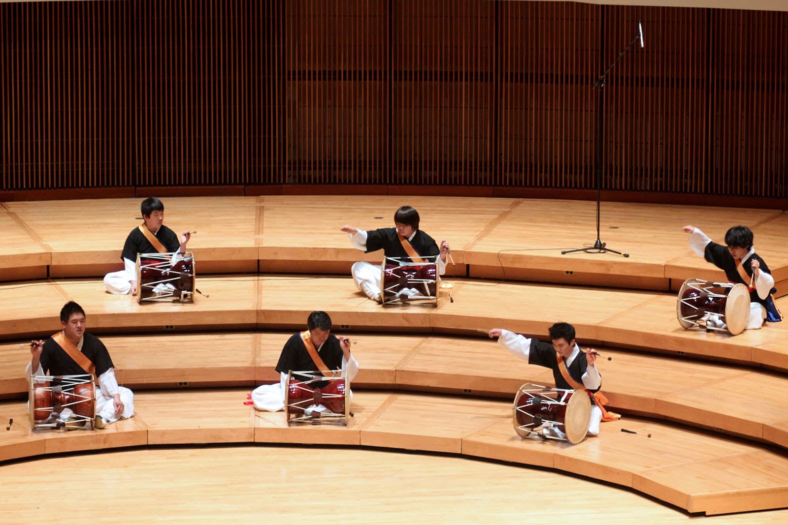The UMD Korean Percussion Ensemble perform Korean folk music on stage.