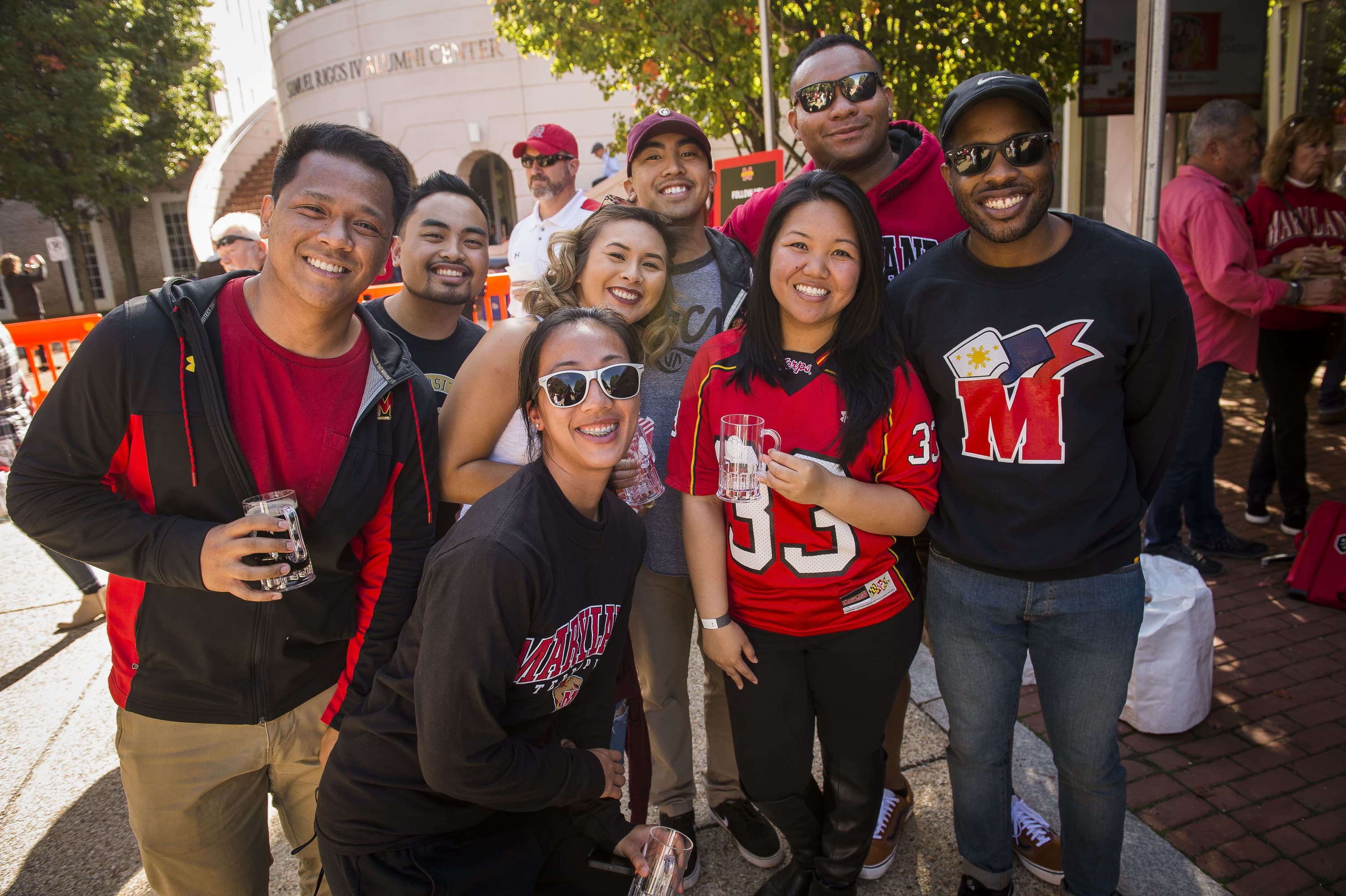 Group of Alumni Posing at the Alumni Homecoming Tailgate