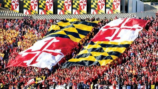 UMD Football game where the flag is unfurled above the fans