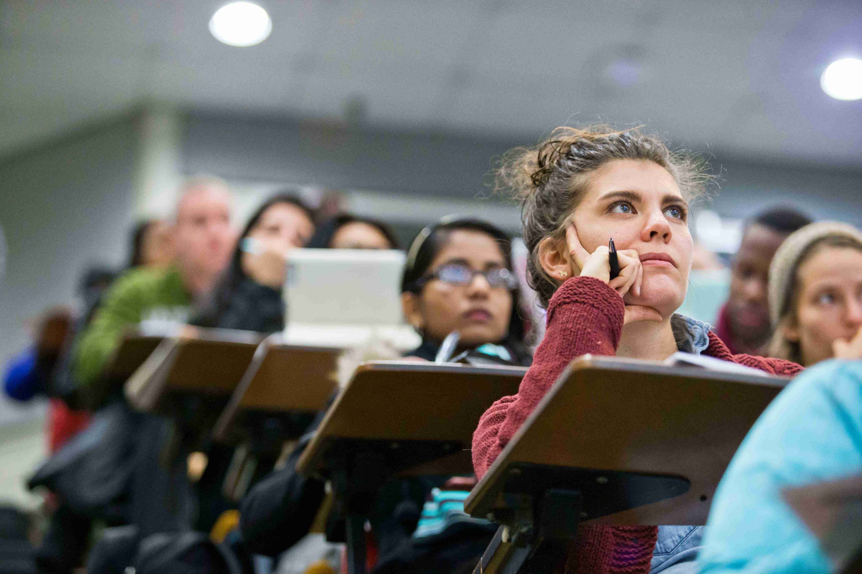 Students sitting at desks in lecture hall